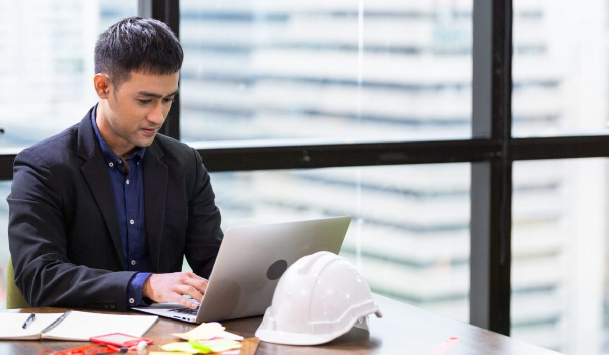 Asian,Male,Engineer,Or,Architect,Sitting,And,Working,On,Laptop